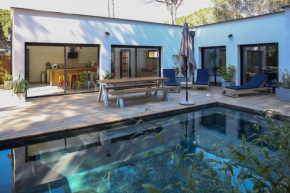 Contemporary house with heated pool in a magnificent pine forest